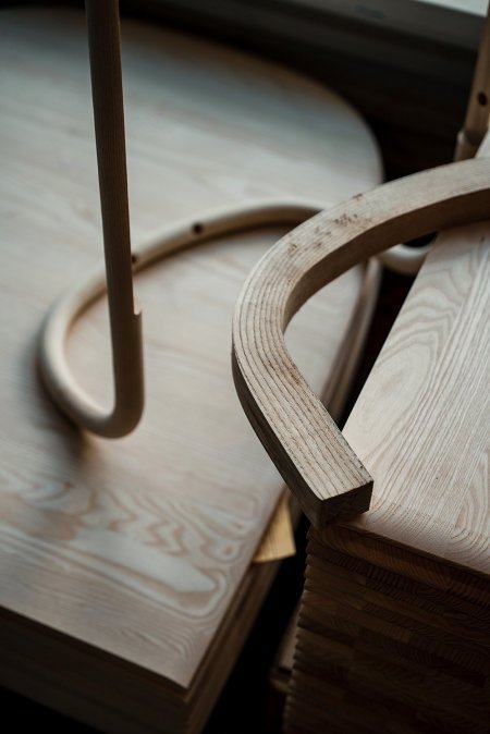  A comparison of when the piece of wood is first bent and how it is expertly sanded to form a piece of furniture 