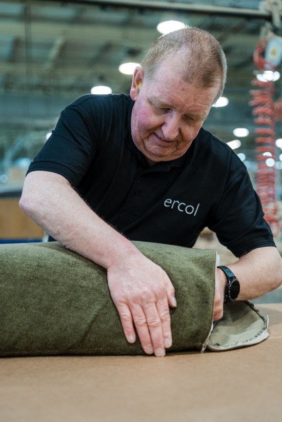 The Evergreen Chair cushions being filled by hand