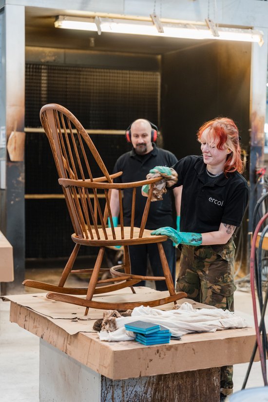 Our apprentice Leah, working with a senior polisher, Sorin, to wipe down a Chairmaker’s Chair in Vintage stain