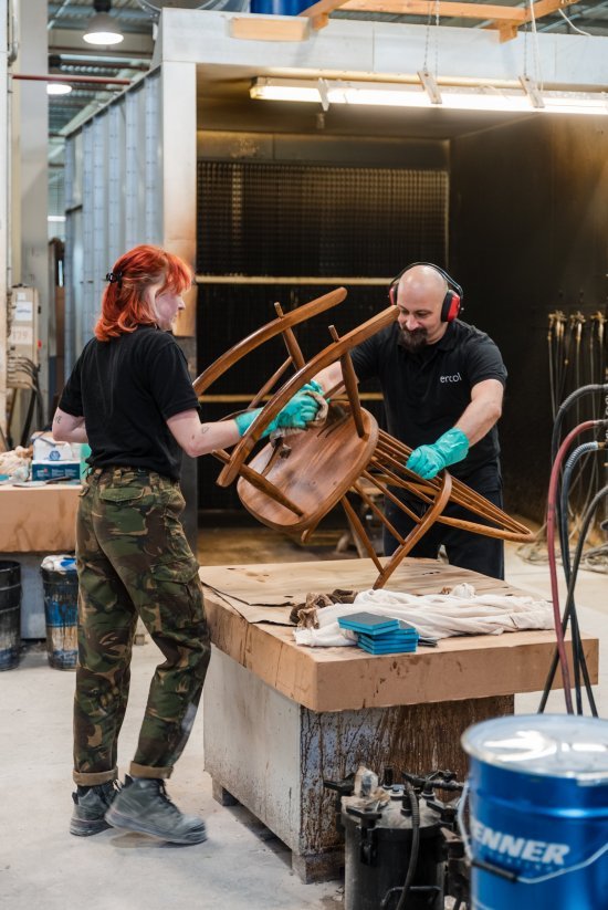 Polishing apprentice with our expert finisher working together on the Chairmakers Rocking Chair in our Vintage (OG) stain