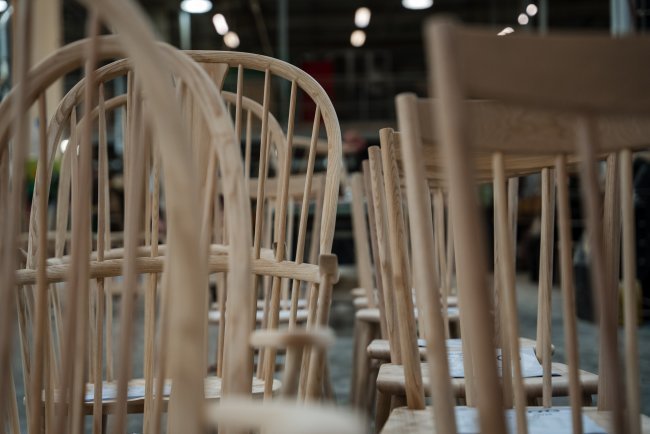 Rows of wooden ercol chairs