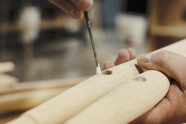 The underframe of a Windsor Chair being hand assembled